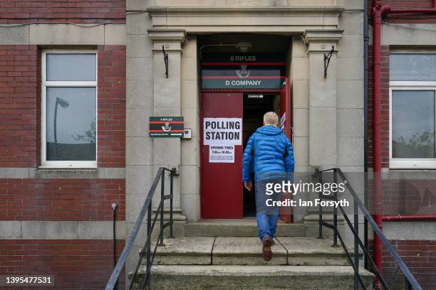 Man arrives to vote as polling stations open across the country in the local elections on May 05, 2022 in Sunderland, England. Voters go to the polls...