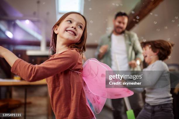 happy little girl having fun while dancing at home. - fee stockfoto's en -beelden