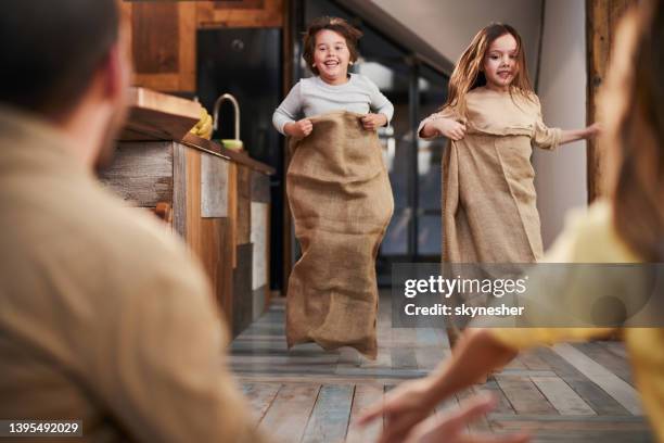 sack race at home! - sack race stock pictures, royalty-free photos & images