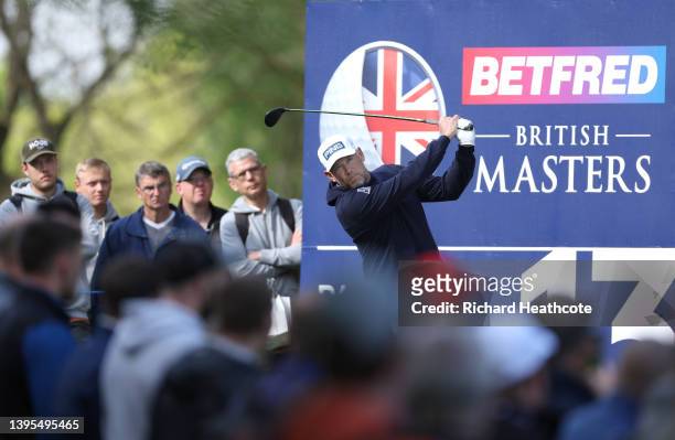 Lee Westwood of England tees off on the 13th hole during the first round of the Betfred British Masters hosted by Danny Willett at The Belfry on May...