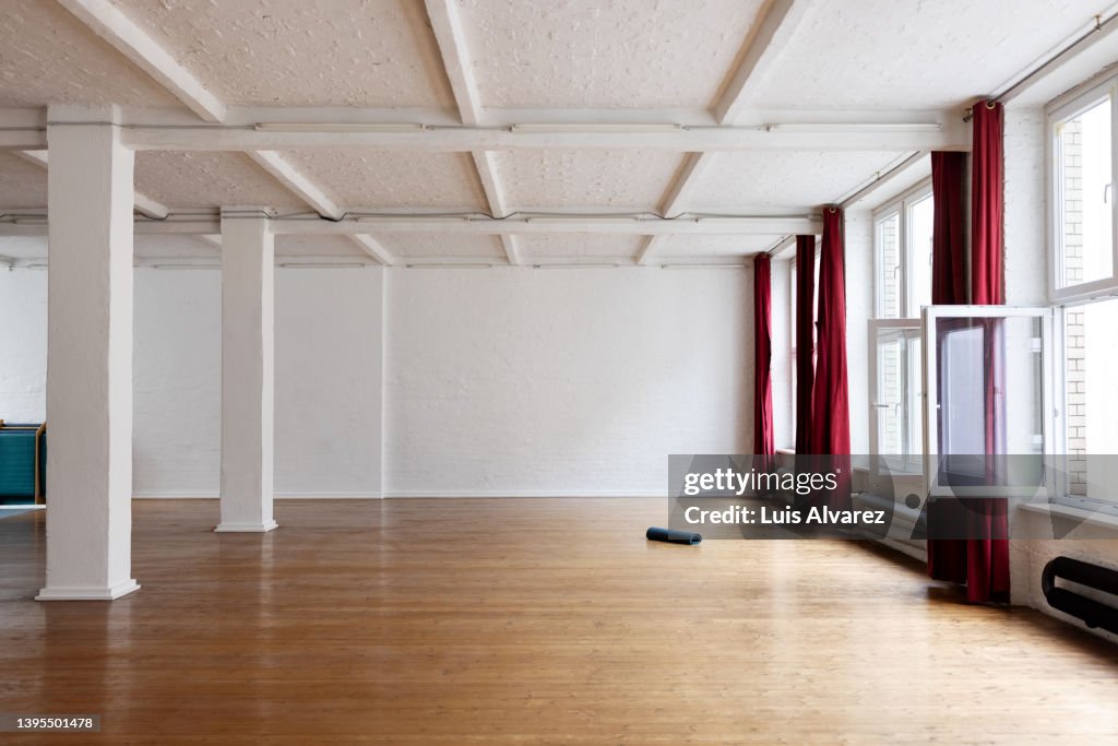 Interior of a yoga class with hardwood floor