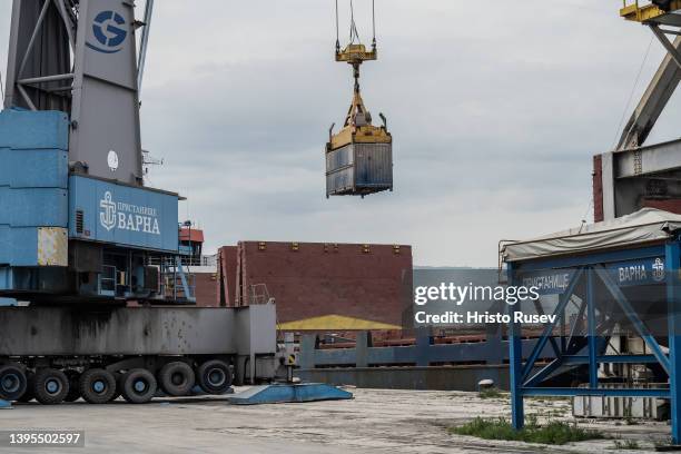 Crane loads container with grain on a cargo ship at Varna West Port on May 4, 2022 in Varna, Bulgaria. Bulgaria's parliament voted and pledged to...