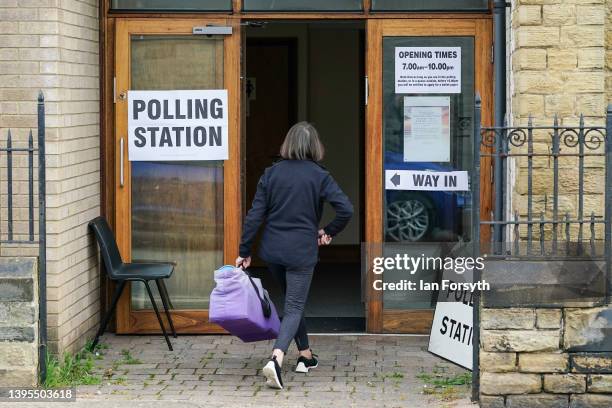 Person arrives to cast their vote in the local election at a polling station on May 05, 2022 in Sunderland, England. Voters go to the polls in the...