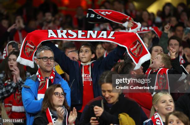 Fans of Arsenal hold up a scarf during the Barclays FA Women's Super League match between Arsenal Women and Tottenham Hotspur Women at Emirates...