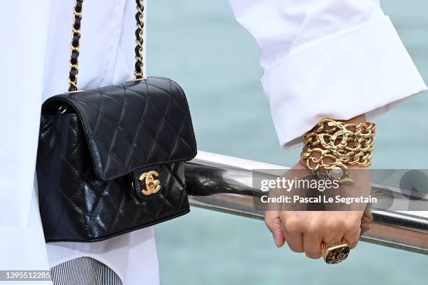 Carole Bouquet, bag detail, attends the Chanel Cruise 2023 Collection on May 05, 2022 in Monte-Carlo, Monaco.