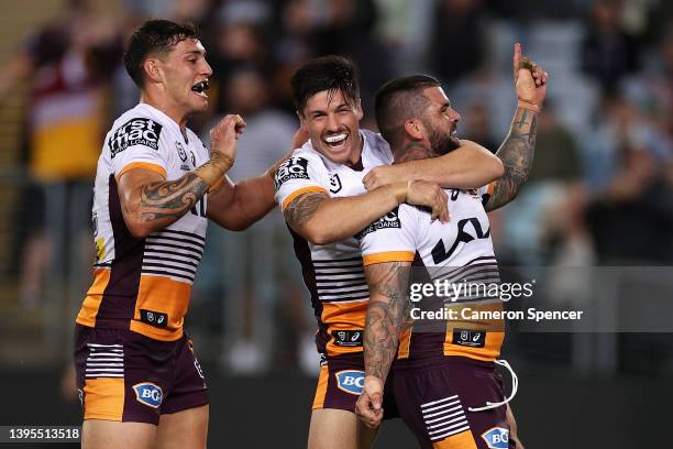 Adam Reynolds of the Broncos celebrates scoring a try during the round nine NRL match between the South Sydney Rabbitohs and the Brisbane Broncos at...