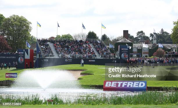 Competitors putt on the 18th green during the first round of the Betfred British Masters hosted by Danny Willett at The Belfry on May 05, 2022 in...