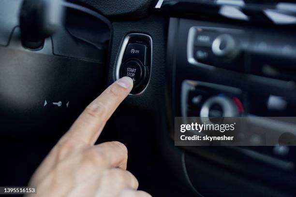 pushing start/stop engine button in a car! - start or stop button stock pictures, royalty-free photos & images