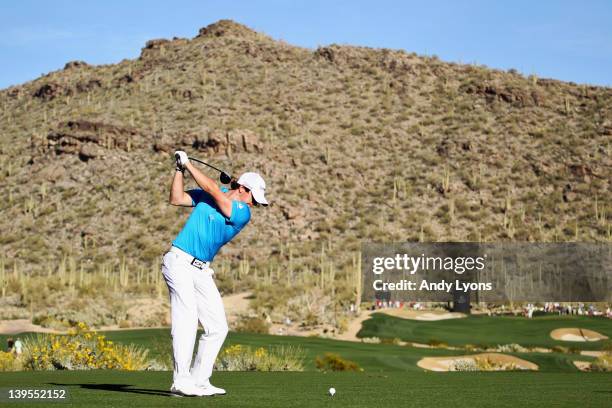Rory McIlroy of Northern Ireland hits his tee shot on the 15th hole during the first round of the World Golf Championships-Accenture Match Play...
