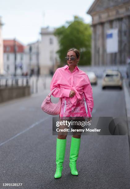 Sonia Lyson seen wearing silver sunglasses from Bottega Veneta, a pink Zara blouse shirt, a pink mini short skirt from Christian Dior, a rose Miu Miu...