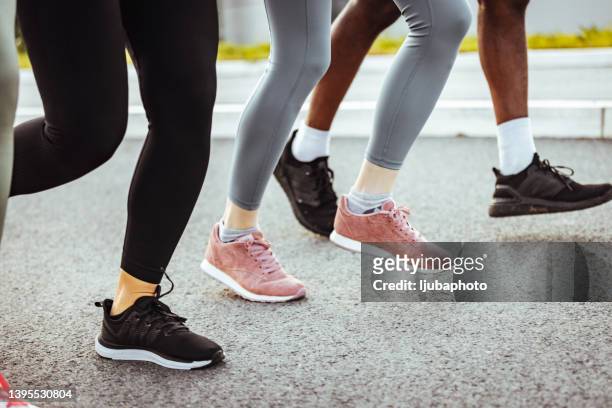 keep putting one foot in front of the other - feet jogging imagens e fotografias de stock