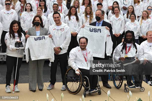 Members of Team USA, U.S. Vice President Kamala Harris and second gentleman Douglas Emhoff pose after they were are presented with Nike shoes and a...