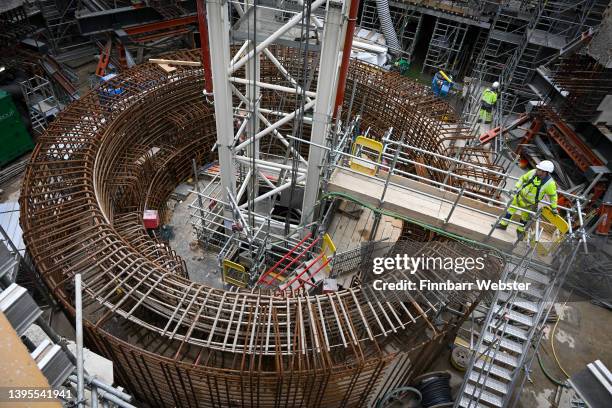 Workman is seen at the area which will house the reactor core during construction work at Hinkley Point C on May 05, 2022 in Bridgwater, England. The...