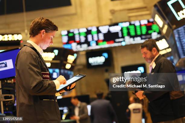 Traders work the floor of the New York Stock Exchange during morning trading on May 05, 2022 in New York City. Stocks opened lower this morning after...