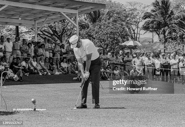 American professional golfer Billy Casper plays golf for an audience of uniformed soldiers and others at Clark Air Base, Luzon, Philippines, February...