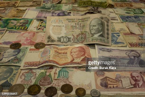 Obsolete Turkish lira banknotes are seen in the window of an exchange office on May 05, 2022 in Istanbul, Turkey. Inflation soared to nearly 70% over...