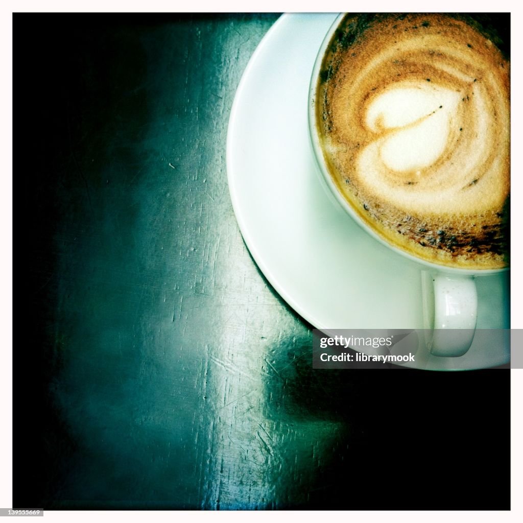 Cappuccino on table, overhead view