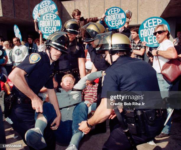 Pro-Life, anti-abortion protesters blocked access route outside clinic are arrested by police and sheriff officers outside a Planned Parenthood...