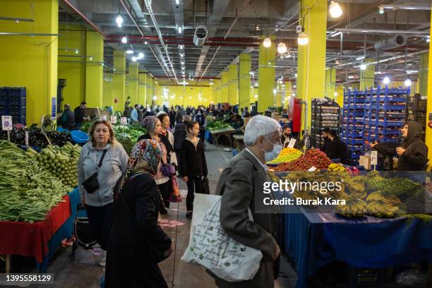 People shop for fresh fruit and vegetables at an open-air market on May 05, 2022 in Istanbul, Turkey. Inflation soared to nearly 70% over one year in...
