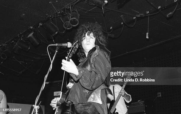 Wearing bat wings, singer-guitarist Marc Bolan performs with T Rex at the Joint in the Woods, October 2, 1974. Bassist Steve Currie is behind him.