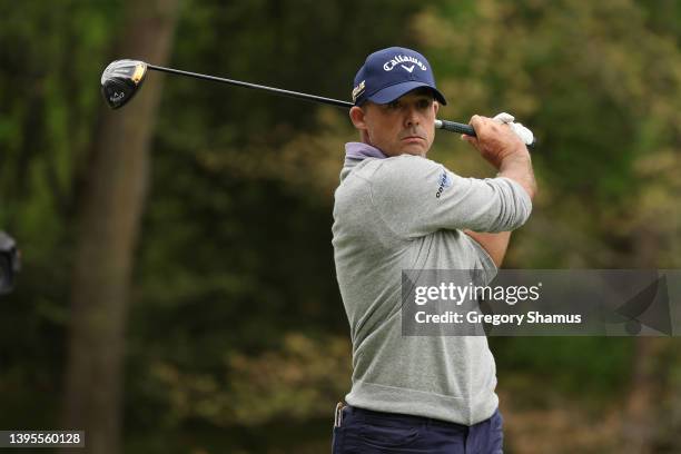 Jonathan Byrd of the United States plays his shot from the 11th tee during the first round of the Wells Fargo Championship at TPC Potomac Clubhouse...