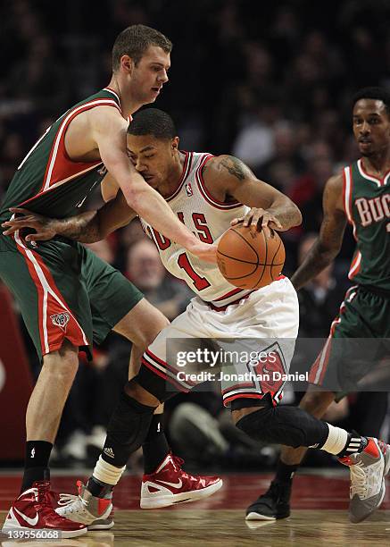 Derrick Rose of the Chicago Bulls moves against Jon Leuer of the Milwaukee Bucks at the United Center on February 22, 2012 in Chicago, Illinois. NOTE...