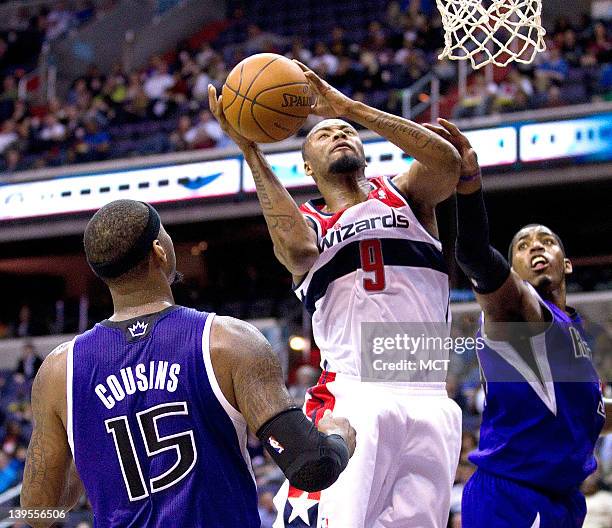 Washington Wizards small forward Rashard Lewis shoots over Sacramento Kings power forward DeMarcus Cousins , left and center Jason Thompson during...