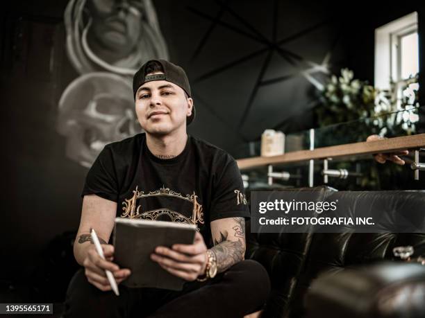 mexican tattoo artist sketching on digital tablet - tattooing 個照片及圖片檔