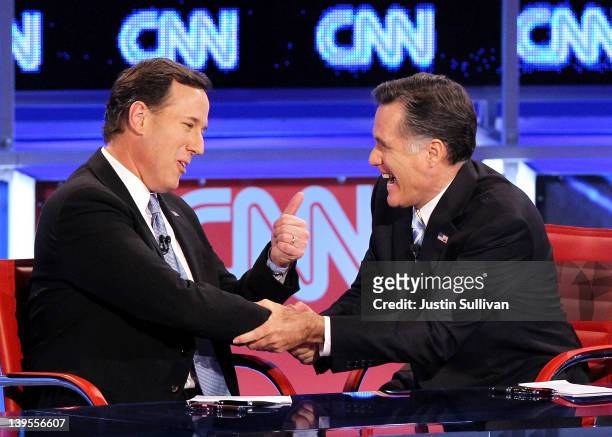 Republican presidential candidates U.S. Rep. Former U.S. Sen. Rick Santorum and former Massachusetts Gov. Mitt Romney talk after participating in a...