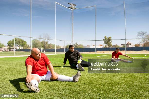 soccer team stretching - fat soccer players stock pictures, royalty-free photos & images