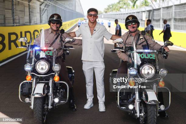 Pierre Gasly of France and Scuderia AlphaTauri poses for a photo with police officers on motorbikes during a track walk during previews ahead of the...