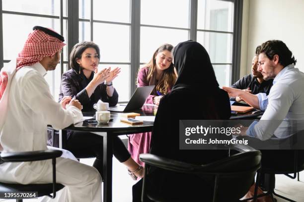 young riyadh business team collaborating in meeting room - saudi women stock pictures, royalty-free photos & images