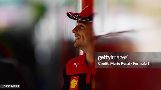 Charles Leclerc of Monaco and Ferrari looks on in the Paddock during previews ahead of the F1 Grand Prix of Miami at the Miami International...