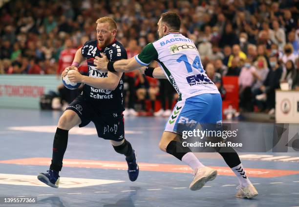 Jim Gottfridsson of SG Flensburg-Handewitt challenges Jacob Bagersted of FRISCH AUF! Göppingen during the LIQUI MOLY HBL match between SG...