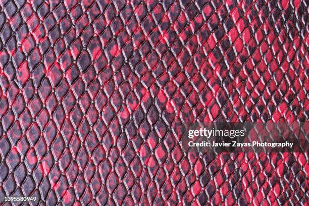 red leather texture background - snake texture stock pictures, royalty-free photos & images