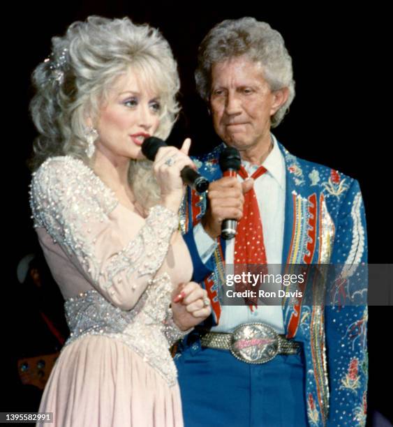 Former duet partners, American singer-songwriter, actress, and businesswoman Dolly Parton and American country music singer Porter Wagoner , sing on...