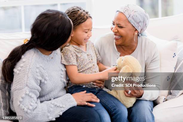 grandmother visits with her family - cancer survivor stock pictures, royalty-free photos & images