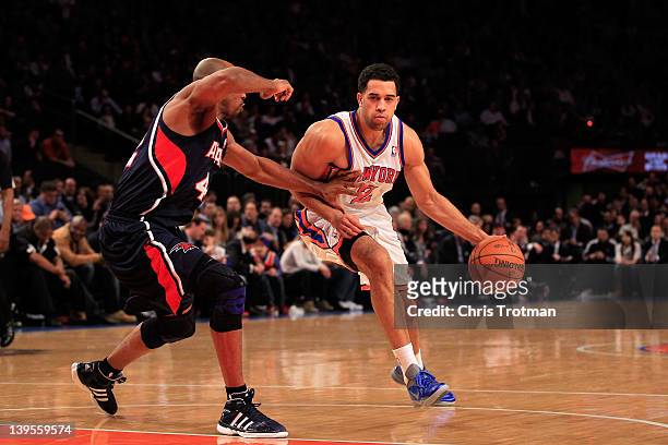 Landry Fields of the New York Knicks drives against Jerry Stackhouse of the Atlanta Hawks at Madison Square Garden on February 22, 2012 in New York...