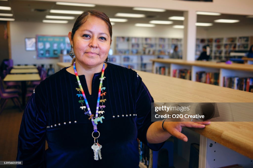 High School Teacher in a Library