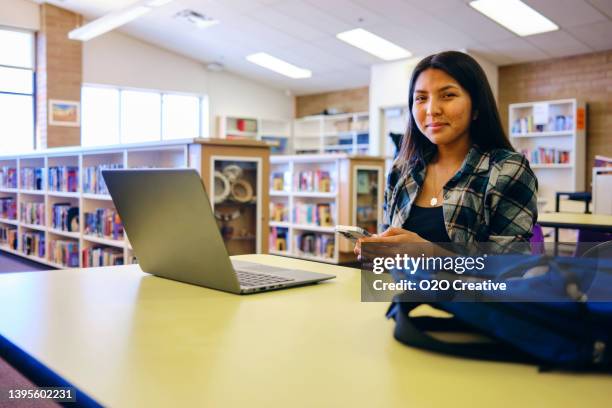 high school student in a library - aboriginal girl stock pictures, royalty-free photos & images