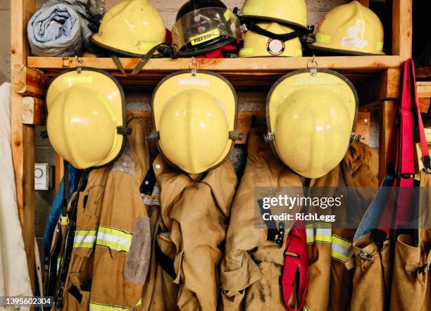 equipment in a fire station - brandweeruniform stockfoto's en -beelden