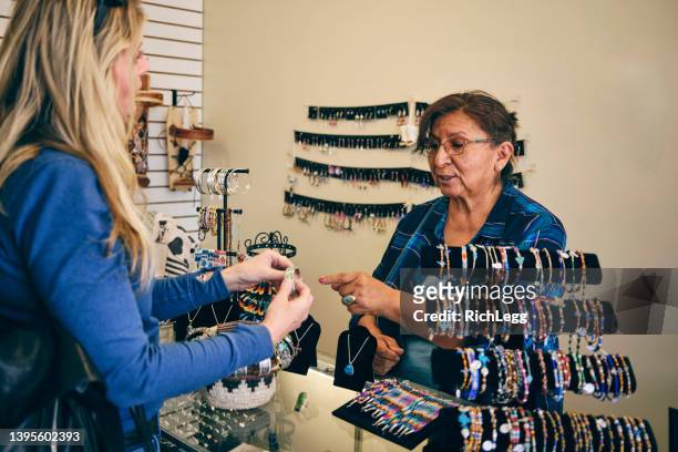 jewerly shop owner with a customer - indian economy business and finance bildbanksfoton och bilder