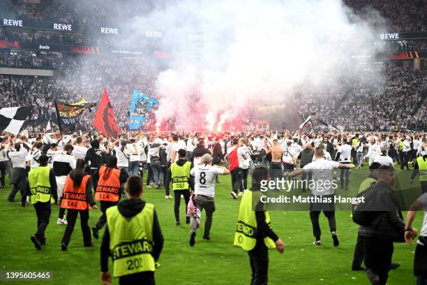 Eintracht Frankfurt invade the pitch following victory in the UEFA Europa League Semi Final Leg Two match between Eintracht Frankfurt and West Ham...