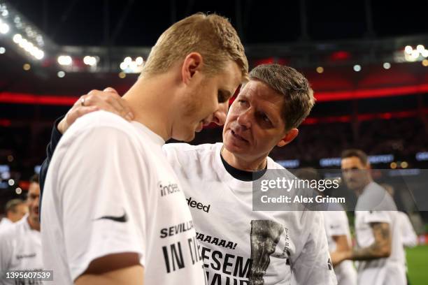 Oliver Glasner, Head Coach of Eintracht Frankfurt interacts with Martin Hinteregger of Eintracht Frankfurt following their sides victory in the UEFA...