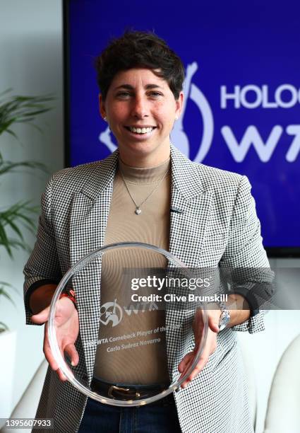 Carla Suarez Navarro of Spain with her 2021 WTA Comeback Player of the Year Award during day seven of the Mutua Madrid Open at La Caja Magica on May...
