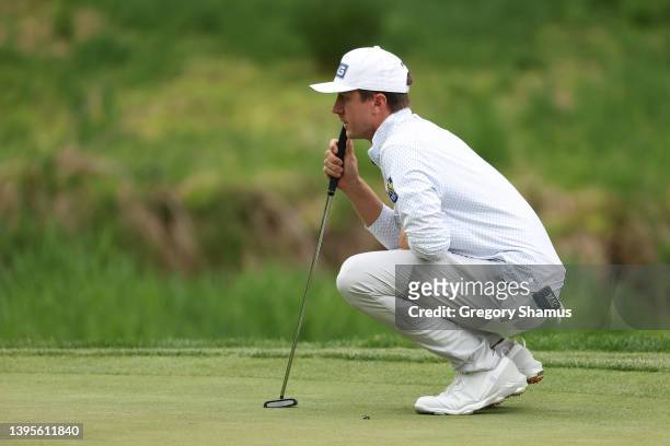 Mackenzie Hughes of Canada lines up his putt on the tenth green during the first round of the Wells Fargo Championship at TPC Potomac Clubhouse on...