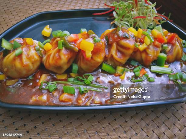 vegetarian momos/dumplings served with sauce & fresh salad - momo stock pictures, royalty-free photos & images