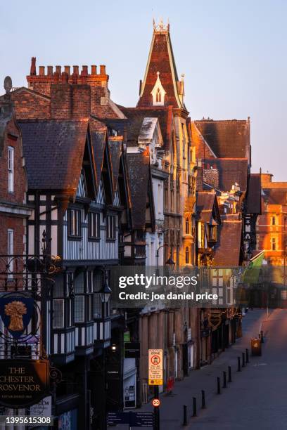 vertical, eastgate street, sunrise, chester, cheshire, england - chester england stock pictures, royalty-free photos & images