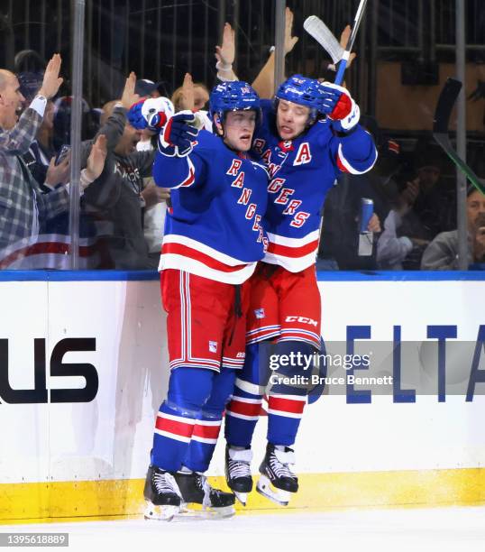 Andrew Copp of the New York Rangers celebrates his first period goal along with Artemi Panarin against the Pittsburgh Penguins in Game Two of the...