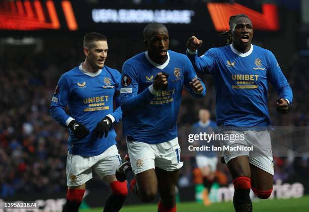 Glen Kamara of Rangers celebrates after scoring their sides second goal by kissing his black arm band in honour of kit man Jimmy Bell uring the UEFA...